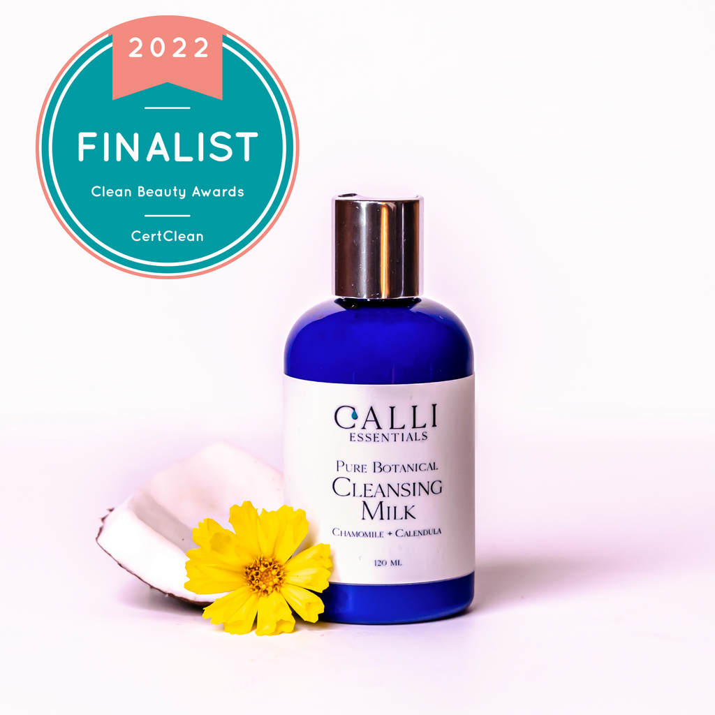 bottle of cleanser milk with an awards badgei