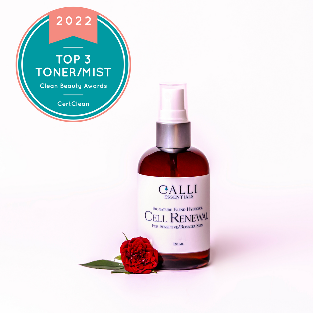 Bottle of cell renew hydrosol  with a fresh rose beside the bottle. An award badge for clean beauty is in the top left hand corner rose. A award