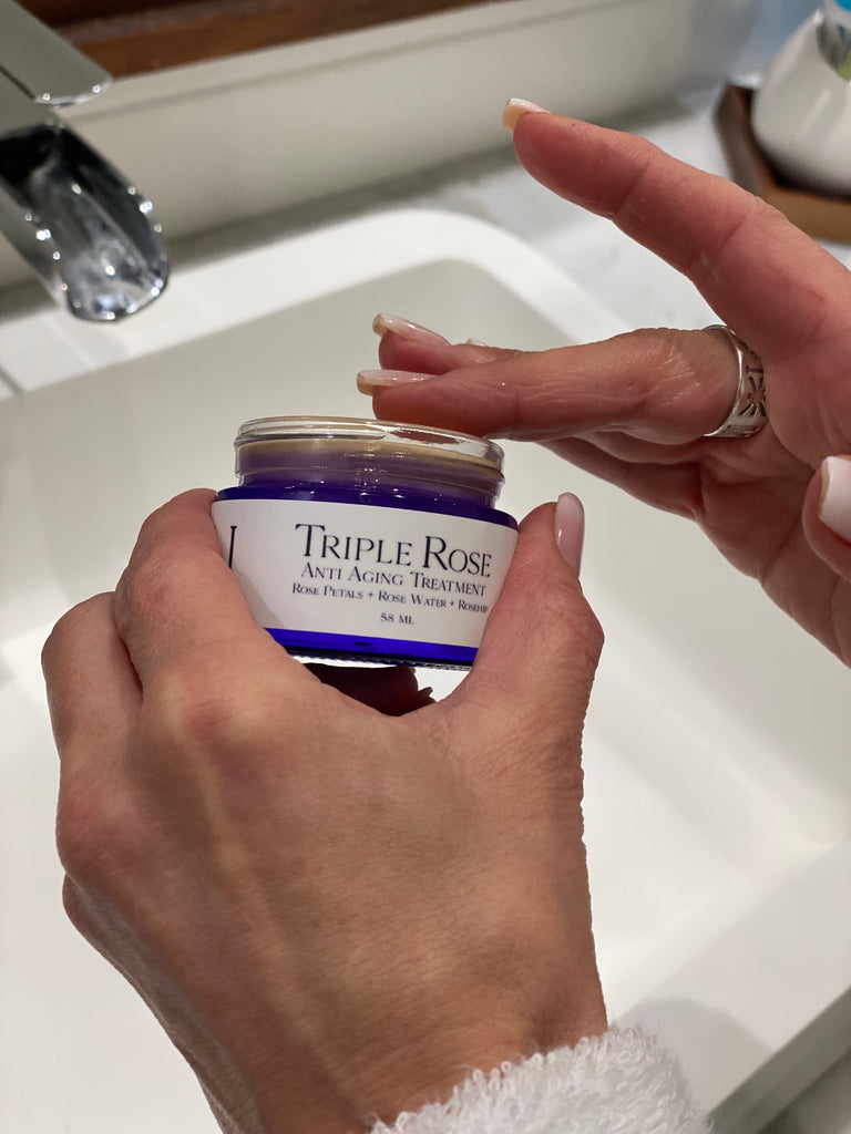 Triple Rose Cream + Lipo-Amino & Hyaluronic Acids -women's hands taking cream from jar