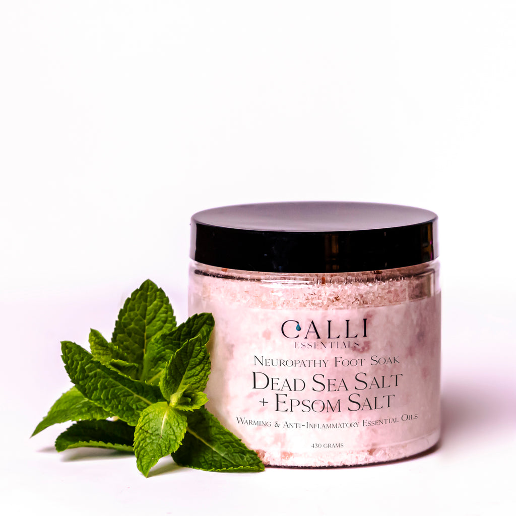500 gram jar of neuropathy foot soak salts with green leaf beside
