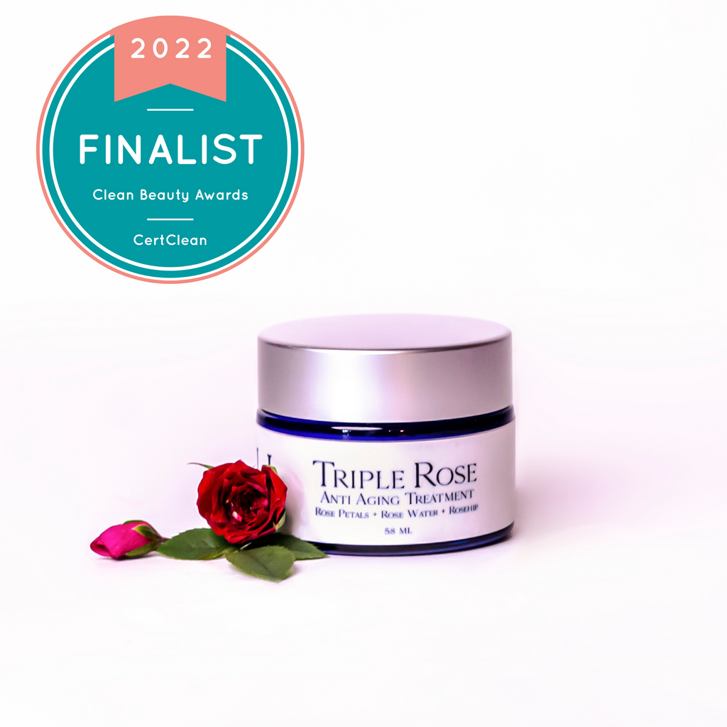 triple rose face cream.  Winners badge in upper corner, fresh roses beside the jar